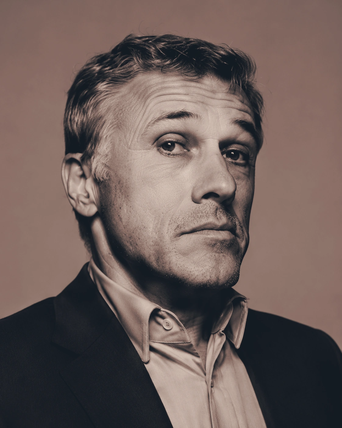 Editorial portrait of a man in a suit
