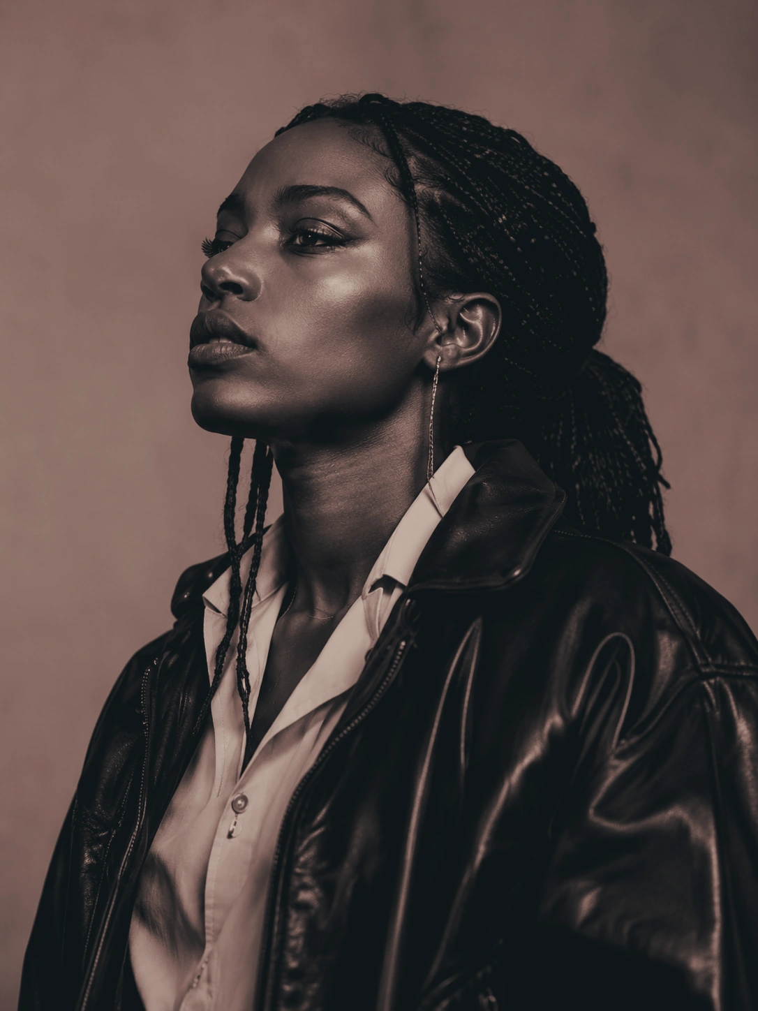 Editorial portrait of a woman in a leather jacket