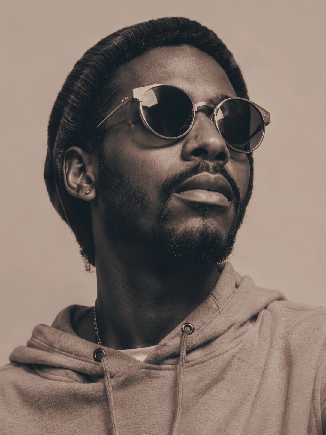 Editorial portrait of a man wearing sunglasses